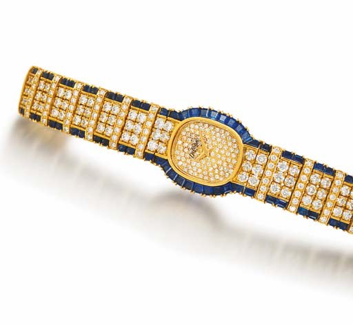 DELANEAU. A LADY'S 18K GOLD, DIAMOND AND SAPPHIRE-SET TONNEAU-SHAPED WRISTWATCH WITH BRACELET