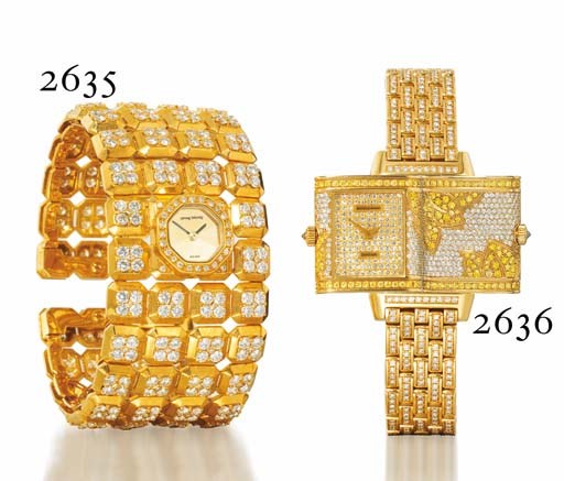 GERALD GENTA. A LADY'S 18K GOLD AND DIAMOND-SET BANGLE WATCH