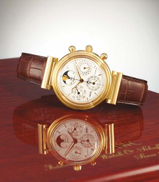 IWC. A RARE LIMITED EDITION 18K GOLD PERPETUAL CALENDAR TOURBILLON CHRONOGRAPH WRISTWATCH WITH PHASES OF THE MOON
