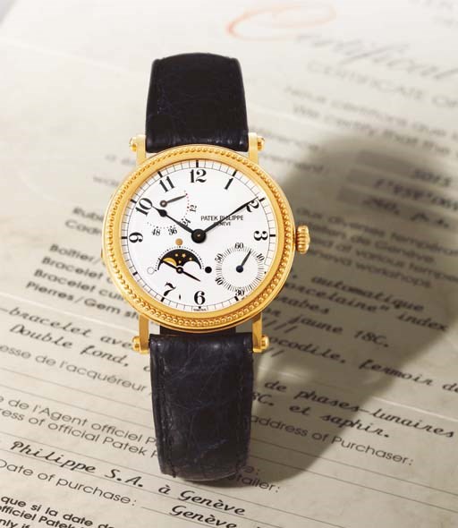 PATEK PHILIPPE. A FINE 18K GOLD AUTOMATIC WRISTWATCH WITH POWER RESERVE AND PHASES OF THE MOON