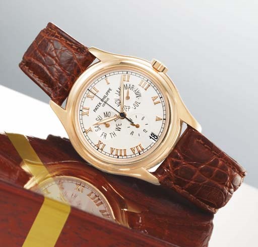 PATEK PHILIPPE. A FINE 18K PINK GOLD AUTOMATIC ANNUAL CALENDAR WRISTWATCH WITH CENTRE SECONDS AND DATE