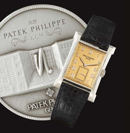 PATEK PHILIPPE. A FINE AND RARE LIMITED EDITION 18K WHITE GOLD FLARED RECTANGULAR WRISTWATCH