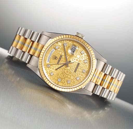 ROLEX. AN 18K THREE-COLOURED GOLD AND DIAMOND-SET AUTOMATIC DAY-DATE WRISTWATCH WITH CENTRE SECONDS AND BRACELET