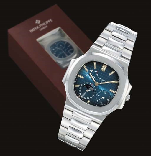 PATEK PHILIPPE. A FINE AND RARE STAINLESS STEEL AUTOMATIC WRISTWATCH WITH POWER RESERVE, DATE, PHASES OF THE MOON AND BRACELET IN FACTORY SEALED BOX