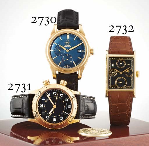 IWC. AN UNUSUAL AND RARE 18K GOLD RECTANGULAR AUTOMATIC PERPETUAL CALENDAR WRISTWATCH WITH PHASES OF THE MOON AND BLACK DIAL