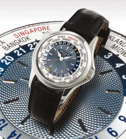 PATEK PHILIPPE. A FINE AND VERY RARE LIMITED EDITION PLATINUM AUTOMATIC WORLD TIME WRISTWATCH WITH 24 HOUR INDICATION