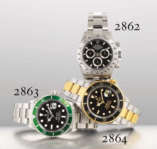 ROLEX. A STAINLESS STEEL AUTOMATIC WRISTWATCH WITH CENTRE SECONDS, DATE, BRACELET AND GREEN BEZEL
