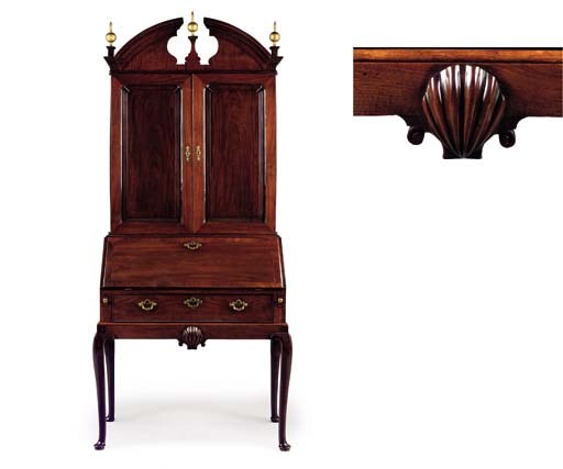 AN IRISH GEORGE III MAHOGANY BUREAU-CABINET-ON-STAND