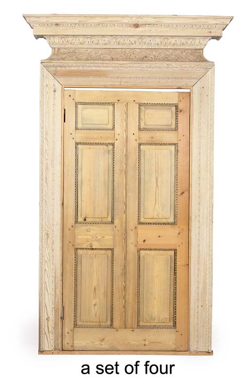 A SET OF FOUR GEORGE II CARVED PINE DOORS