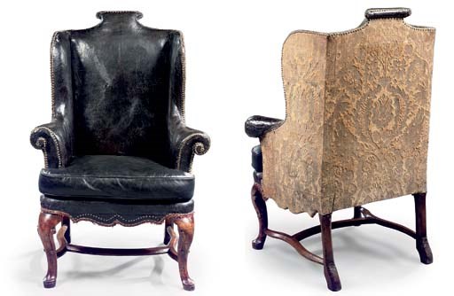 A GEORGE I WALNUT WING ARMCHAIR