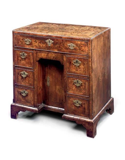 A GEORGE II WALNUT KNEEHOLE DESK