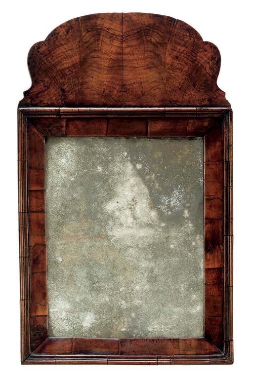 A GEORGE I WALNUT MIRROR