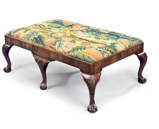 A WALNUT STOOL