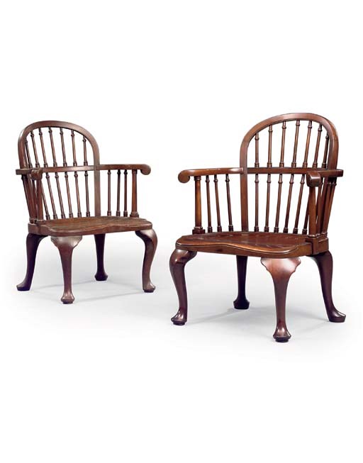 A NEAR PAIR OF MAHOGANY WINDSOR ARMCHAIRS