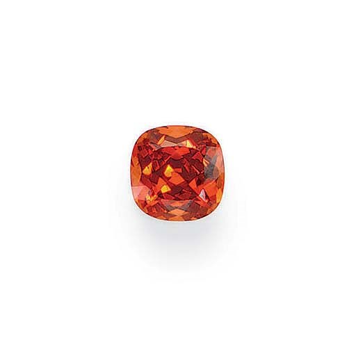 AN UNMOUNTED CUSHION-CUT MANDARIN GARNET