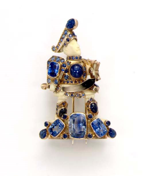 **AN IVORY AND SAPPHIRE WARRIOR BROOCH