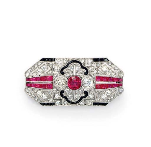 AN ART DECO DIAMOND, RUBY AND ONYX BROOCH