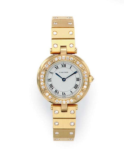 A GOLD AND DIAMOND "SANTOS" WRISTWATCH, BY CARTIER