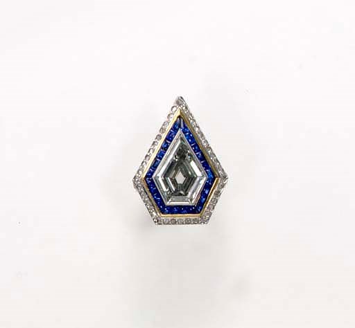 A COLORED DIAMOND AND SAPPHIRE DIAMOND RING