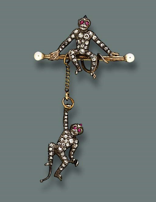 AN ANTIQUE DIAMOND AND RUBY MONKEY BROOCH