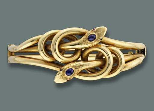 AN ANTIQUE SNAKE BANGLE AND A BRACELET