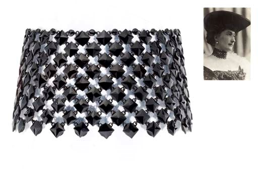 AN ANTIQUE BLACK GLASS CHOKER