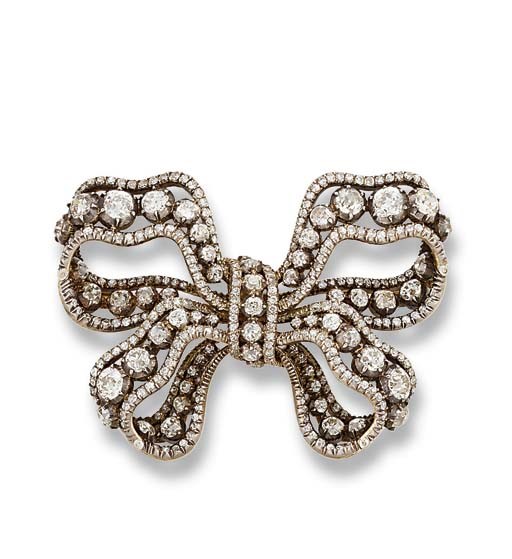 AN ANTIQUE DIAMOND BOW BROOCH, BY MUSY