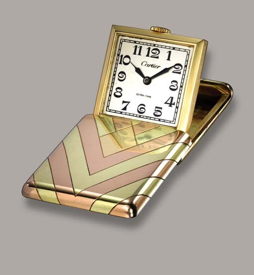 AN ART DECO TRAVEL CLOCK, BY CARTIER