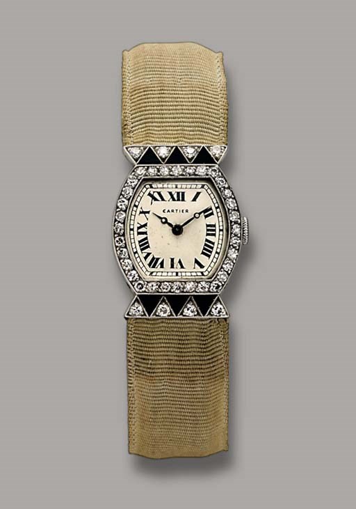 A LADY'S ART DECO DIAMOND AND ONYX WRISTWATCH, BY CARTIER