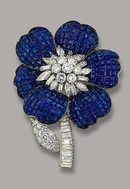 A SAPPHIRE AND DIAMOND FLOWER BROOCH, BY CARTIER