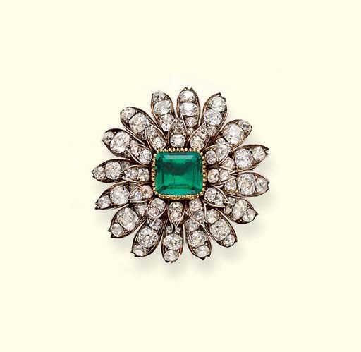 AN ANTIQUE EMERALD AND DIAMOND FLORAL BROOCH