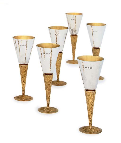 A SET OF SIX ELIZABETH II PARCEL-GILT SILVER GOBLETS