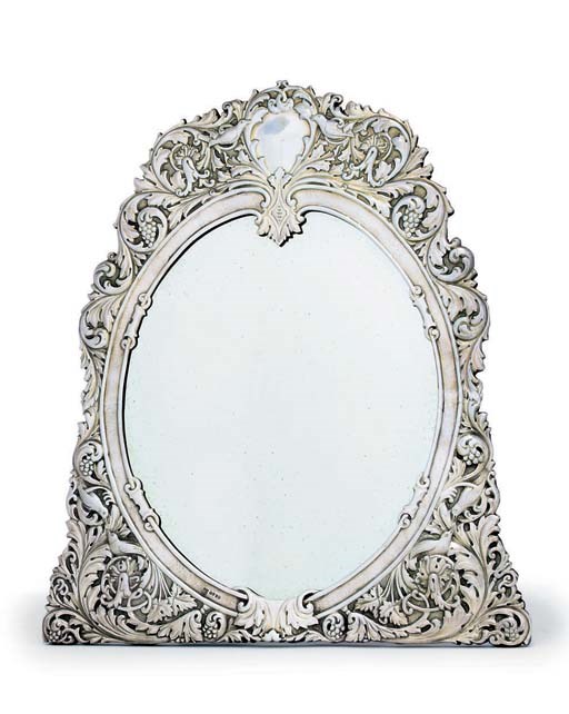 A VICTORIAN SILVER-GILT DRESSING-TABLE MIRROR