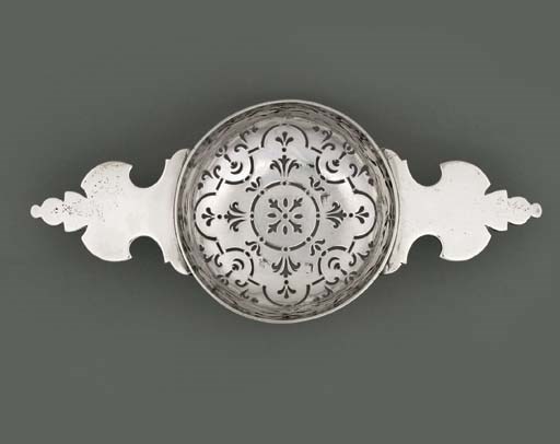A GEORGE II SILVER ORANGE STRAINER