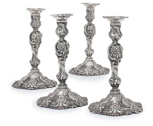FOUR GEORGE II SILVER CANDLESTICKS