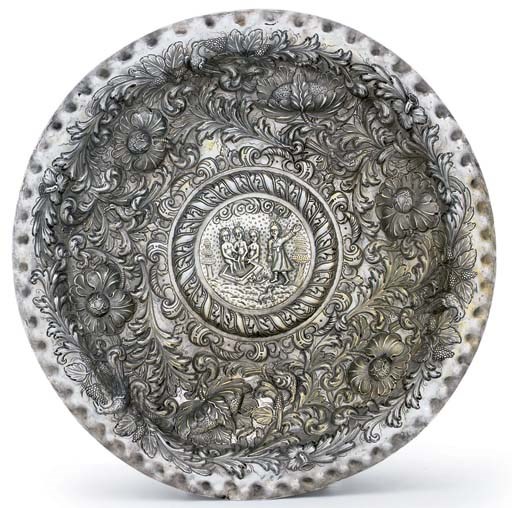 A MASSIVE SILVER CHARGER