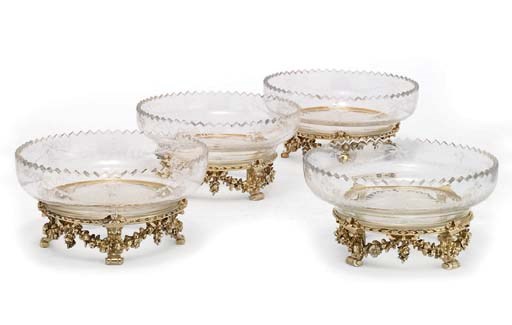 A SET OF FOUR FRENCH SILVER-GILT AND ENGRAVED-GLASS DESSERT-STANDS