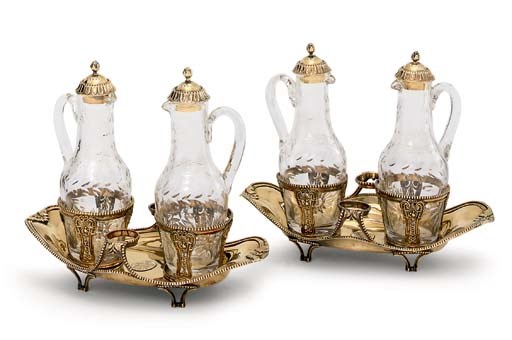 A PAIR OF LOUIS XVI SILVER-GILT TWO-BOTTLE CRUETS