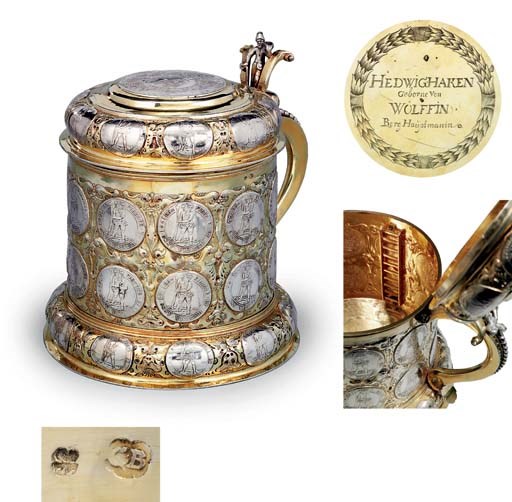 A MAGNIFICENT GERMAN PARCEL-GILT SILVER COIN-SET TANKARD
