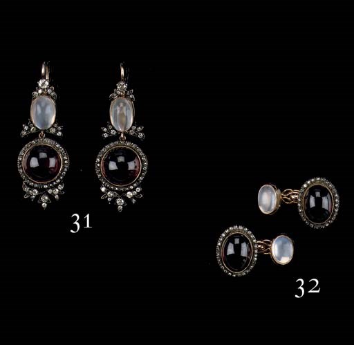 A PAIR OF GARNET AND DIAMOND CUFF LINKS