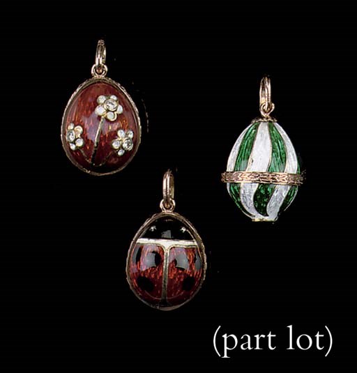 A SET OF FIVE ENAMELLED EGG PENDANTS