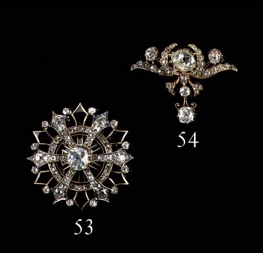 A DIAMOND AND ONYX BROOCH