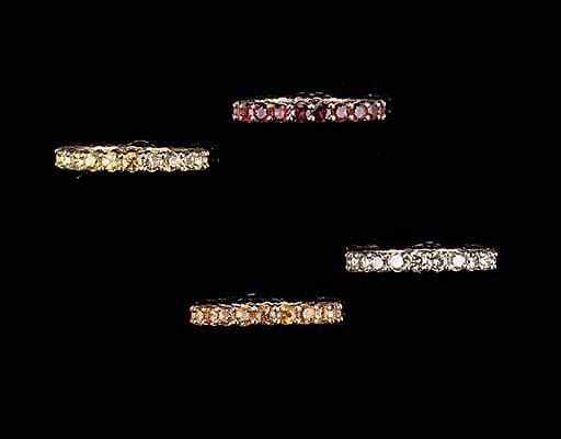 FOUR GEM-SET ETERNITY RINGS