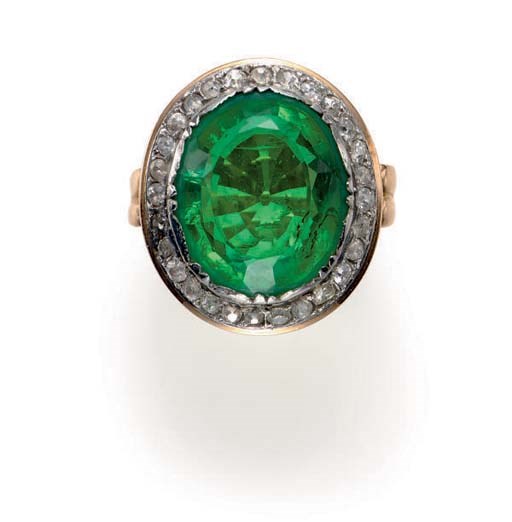 AN EMERALD, DIAMOND AND 18K GOLD RING