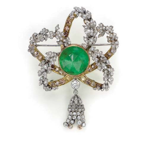AN EMERALD, DIAMOND, COLORED DIAMOND, PLATINUM, AND GOLD BROOCH