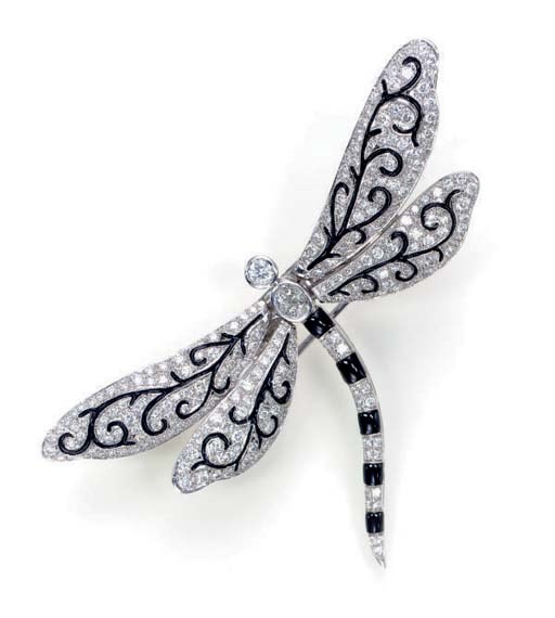 A DIAMOND, ONYX AND 18K WHITE GOLD BUTTERFLY BROOCH