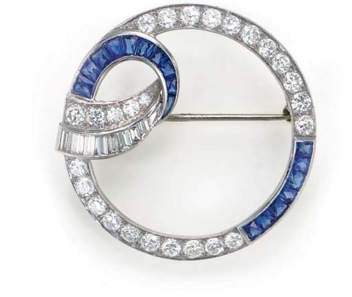 A SAPPHIRE, DIAMOND AND PLATINUM CIRCLE BROOCH