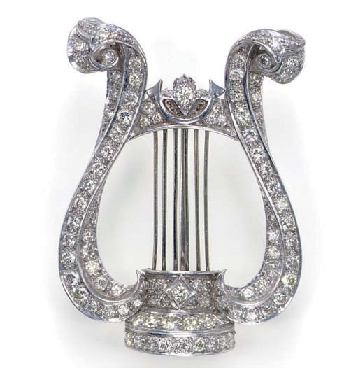 A DIAMOND AND PLATINUM LYRE BROOCH