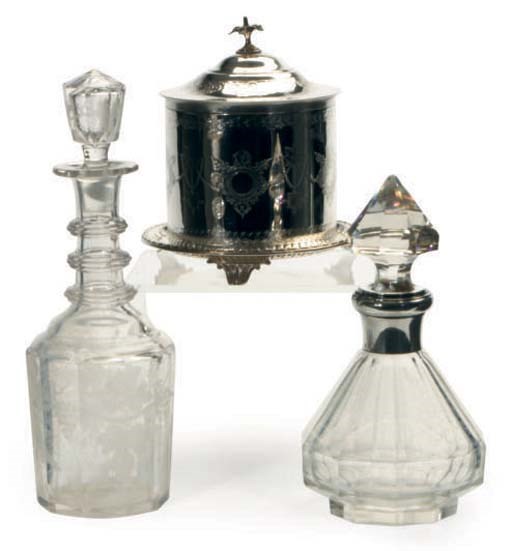 AN ENGLISH SILVER-PLATED BISCUIT BARREL WITH HINGED COVER, A FRENCH SILVER-MOUNTED GLASS DECANTER AND STOPPER, AND TWO GLASS DECANTERS AND STOPPERS,