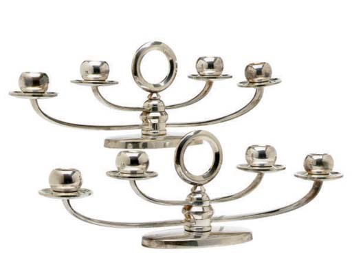 A PAIR OF CONTINENTAL SILVER-PLATED CANDELABRA,